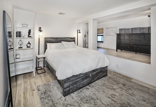 518 Gregory Ave Unit 412A, Weehawken, NJ 07086 - bedroom with baseboards, visible vents, and light wood-style flooring