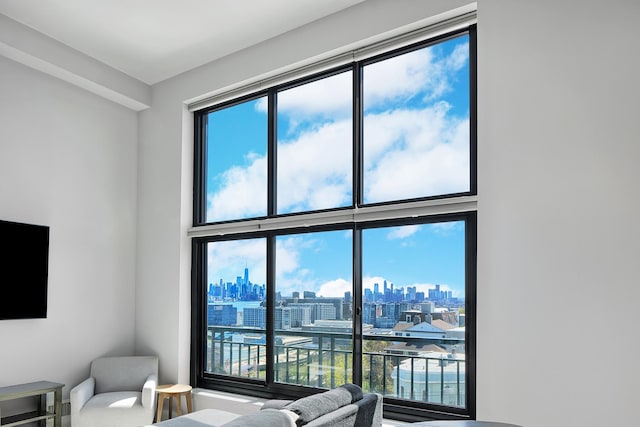 interior space featuring a view of city and a high ceiling