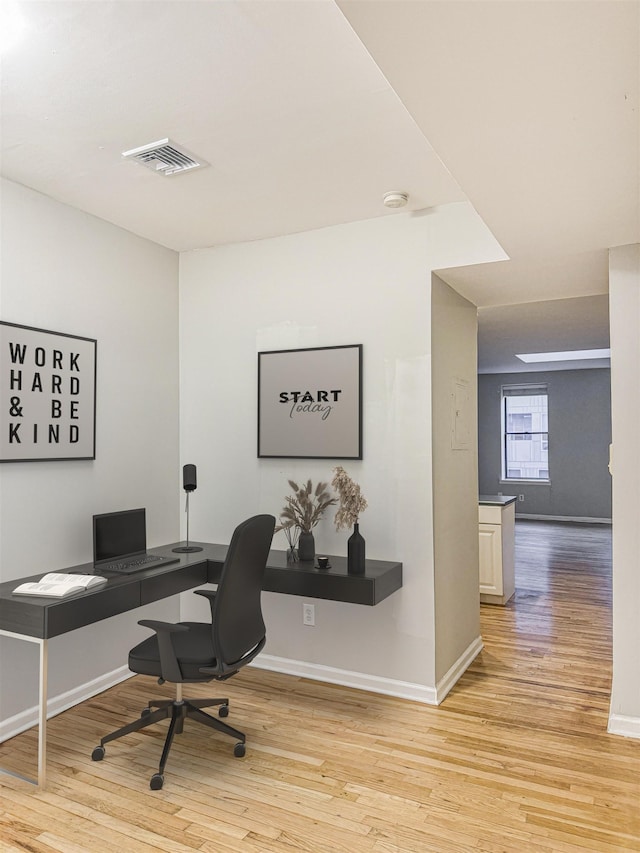 office area featuring light hardwood / wood-style floors