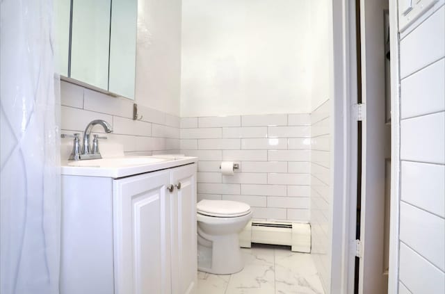 bathroom with vanity, toilet, and baseboard heating