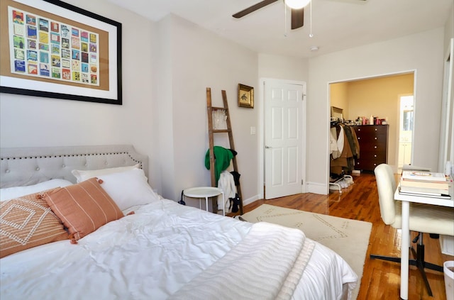 bedroom featuring hardwood / wood-style floors, a closet, and ceiling fan