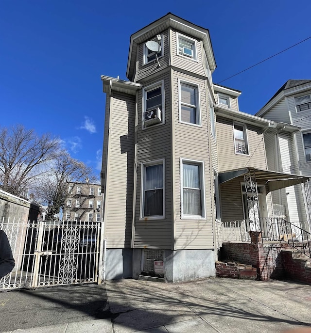 view of front of house with a gate