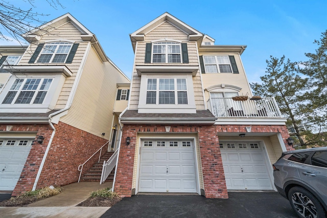 4 Boatworks Dr, Bayonne, NJ 07002 - townhome / multi-family property featuring driveway, a garage, and brick siding