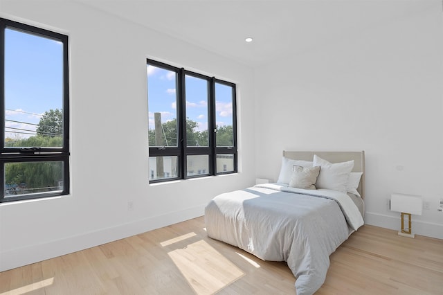 bedroom with light hardwood / wood-style floors