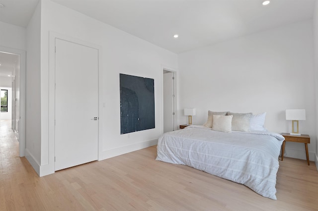 bedroom with light hardwood / wood-style floors