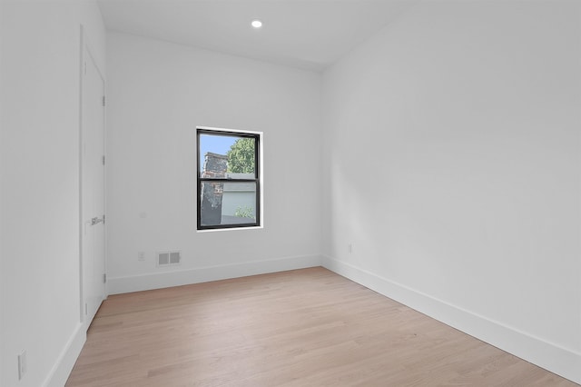 spare room with light hardwood / wood-style floors