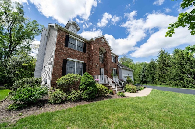 57 Terrace Ave, West Orange, NJ 07052 - view of front of home featuring brick siding, a front yard, and a chimney
