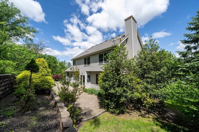57 Terrace Ave, West Orange, NJ 07052 - back of house featuring a patio and a chimney