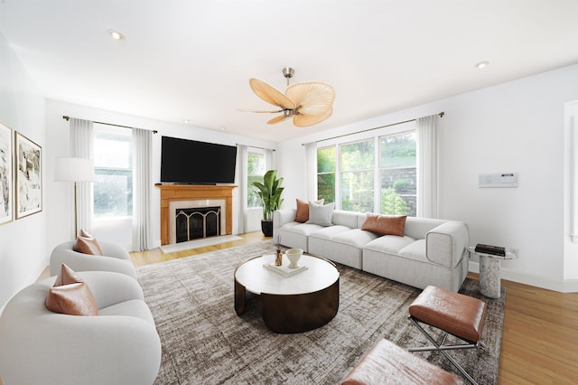 57 Terrace Ave, West Orange, NJ 07052 - living area with wood finished floors, healthy amount of natural light, a fireplace with flush hearth, a ceiling fan, and recessed lighting