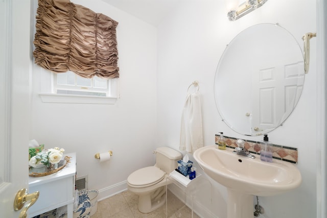 57 Terrace Ave, West Orange, NJ 07052 - half bathroom featuring baseboards, toilet, and a sink
