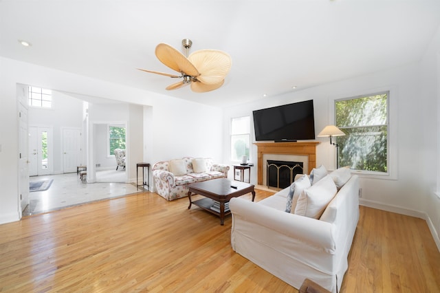 57 Terrace Ave, West Orange, NJ 07052 - living room with light wood finished floors, a fireplace, baseboards, and ceiling fan
