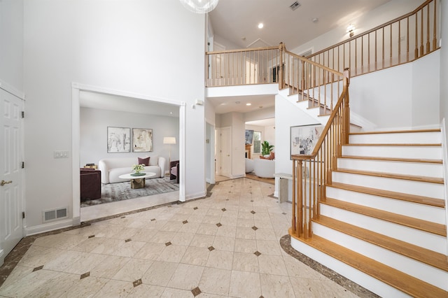 57 Terrace Ave, West Orange, NJ 07052 - entryway featuring a high ceiling, stairway, baseboards, inlaid floor details, and recessed lighting