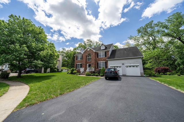 57 Terrace Ave, West Orange, NJ 07052 - view of front of house featuring driveway, a garage, a front yard, and brick siding