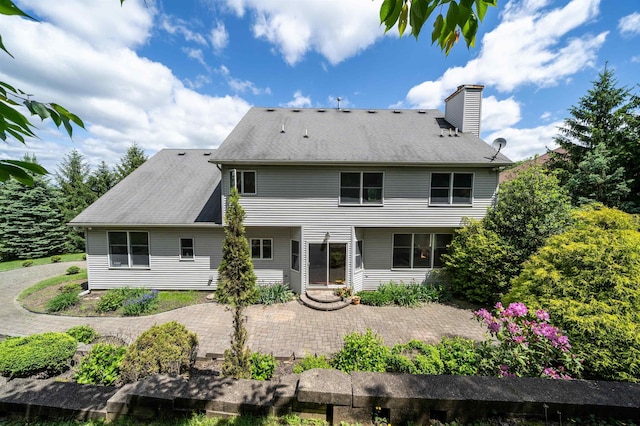 57 Terrace Ave, West Orange, NJ 07052 - back of house with a patio area and a chimney