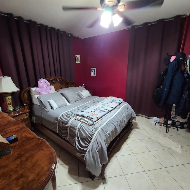 bedroom featuring ceiling fan and light tile patterned floors