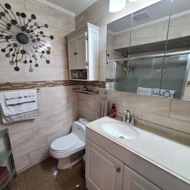 bathroom with tile patterned floors, crown molding, an enclosed shower, and tile walls