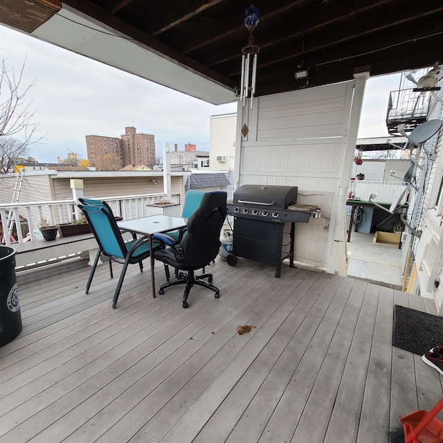 wooden deck featuring area for grilling