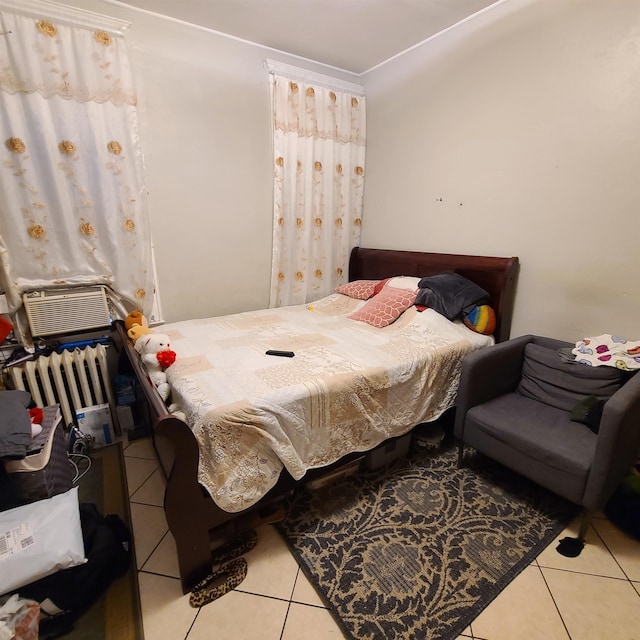 bedroom featuring light tile patterned floors