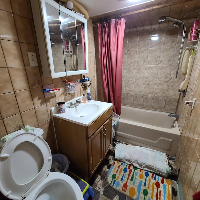 full bathroom featuring vanity, toilet, tile walls, and shower / bath combo with shower curtain