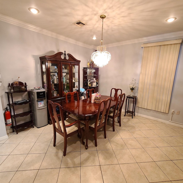 tiled dining room with ornamental molding and an inviting chandelier