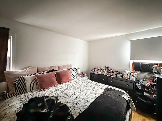 bedroom with wood finished floors
