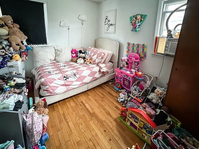 bedroom featuring wood finished floors