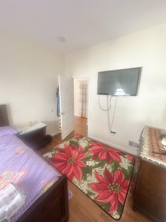 10 Clendenny Ave, Jersey City, NJ 07304 - bedroom featuring visible vents, baseboards, and wood finished floors