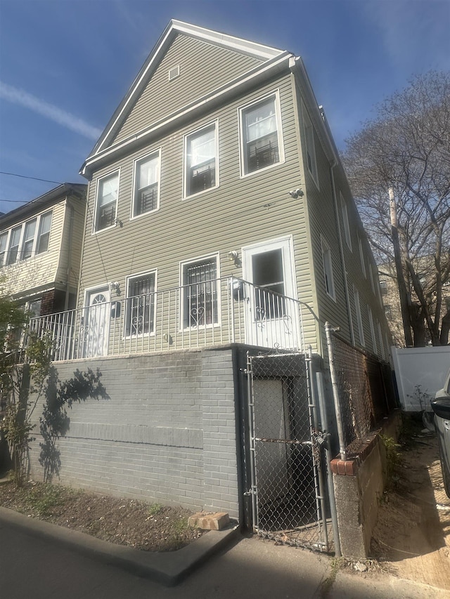 10 Clendenny Ave, Jersey City, NJ 07304 - multi unit property with fence, a gate, and brick siding