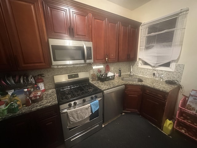 10 Clendenny Ave, Jersey City, NJ 07304 - kitchen featuring a sink, appliances with stainless steel finishes, tasteful backsplash, and stone countertops
