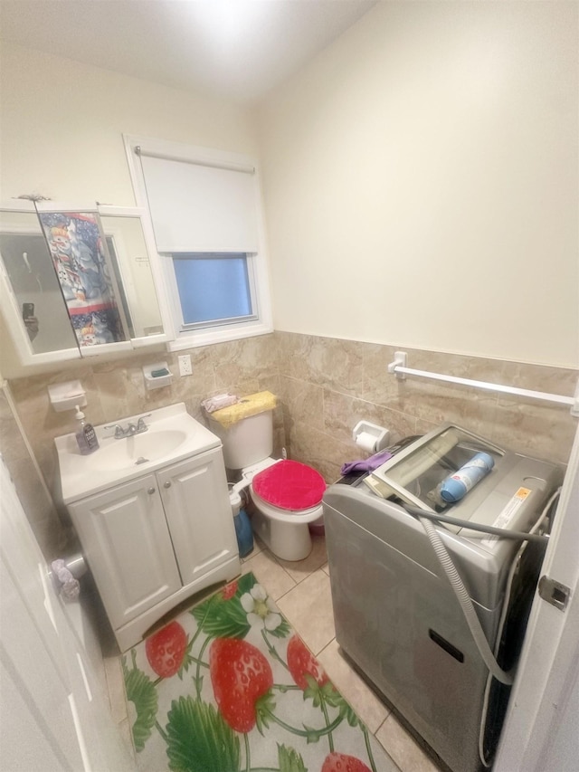 10 Clendenny Ave, Jersey City, NJ 07304 - half bathroom with tile walls, tile patterned flooring, a wainscoted wall, and vanity