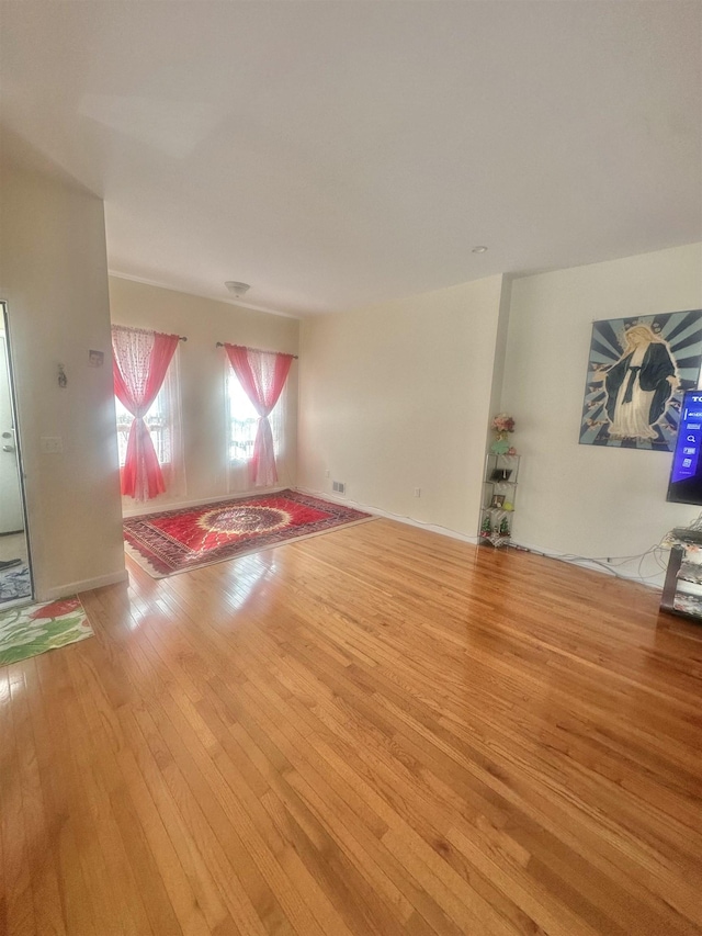 10 Clendenny Ave, Jersey City, NJ 07304 - unfurnished living room featuring wood-type flooring and visible vents