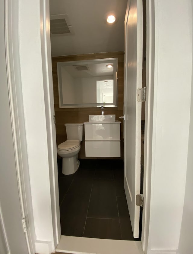 bathroom featuring vanity, visible vents, recessed lighting, tile patterned floors, and toilet