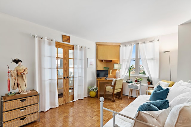 sitting room with french doors and light parquet floors