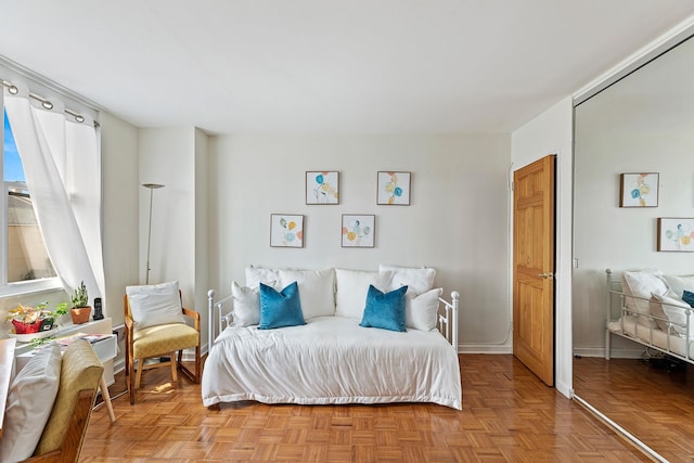 bedroom with light parquet floors