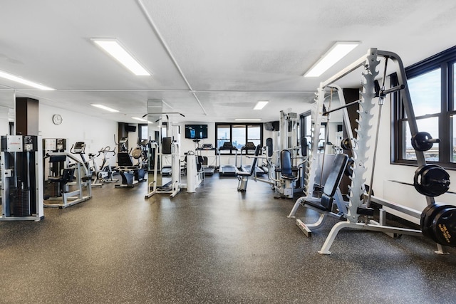 workout area featuring a textured ceiling