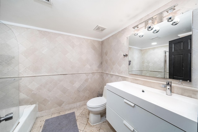 full bathroom featuring tile walls, toilet, vanity, ornamental molding, and visible vents