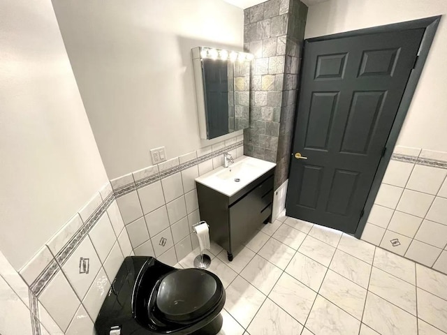 119 W 19th St, Bayonne, NJ 07002 - bathroom with tile walls and vanity