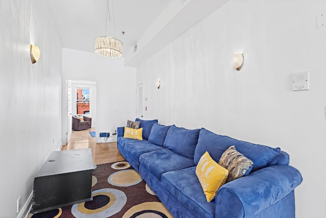 231 Grand St Unit 5R, Hoboken, NJ 07030 - living room with wood finished floors and a chandelier