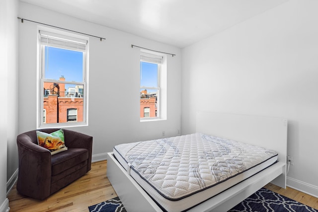 231 Grand St Unit 5R, Hoboken, NJ 07030 - bedroom featuring light wood finished floors and baseboards