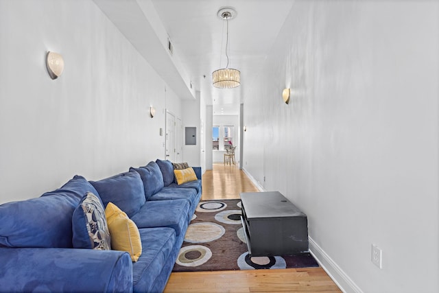 231 Grand St Unit 5R, Hoboken, NJ 07030 - living room featuring wood finished floors, electric panel, and baseboards