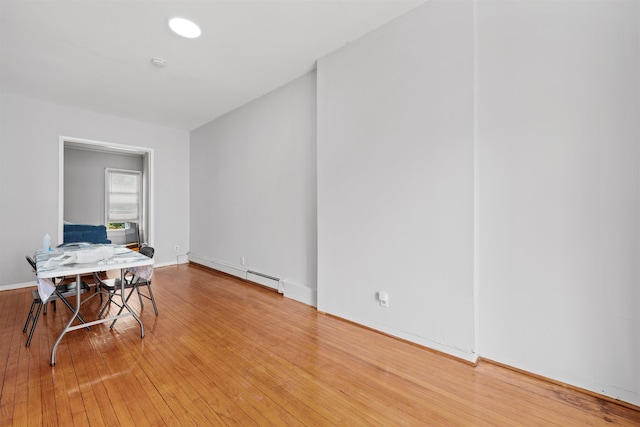 interior space featuring hardwood / wood-style floors and a baseboard radiator