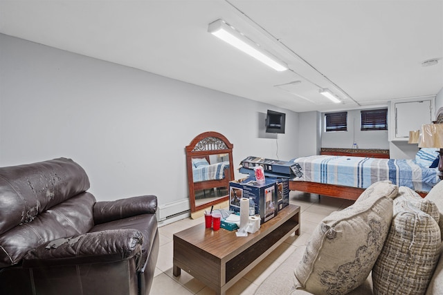 living room with light tile patterned floors and a baseboard radiator