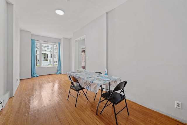 dining space with light wood-type flooring