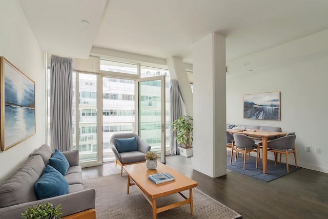 living room featuring dark wood finished floors and baseboards