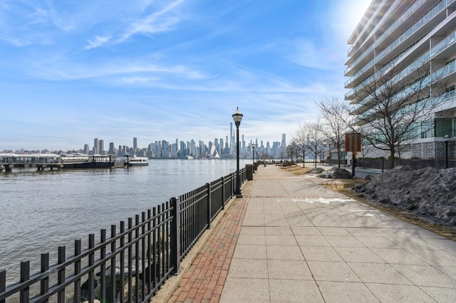 view of community featuring a water view and a view of city