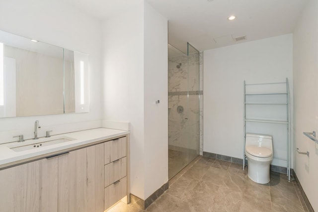 bathroom with a marble finish shower, visible vents, baseboards, toilet, and vanity