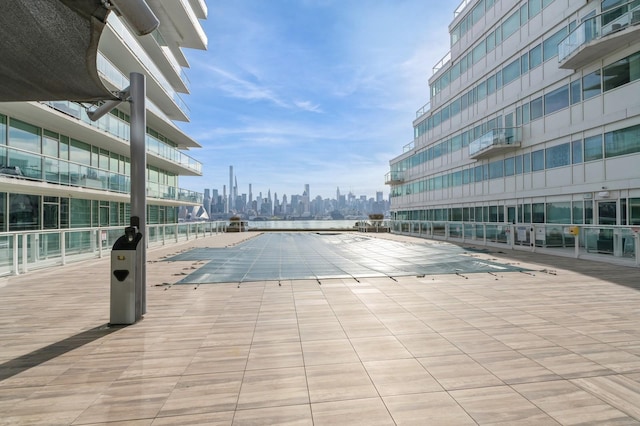 view of pool featuring a city view