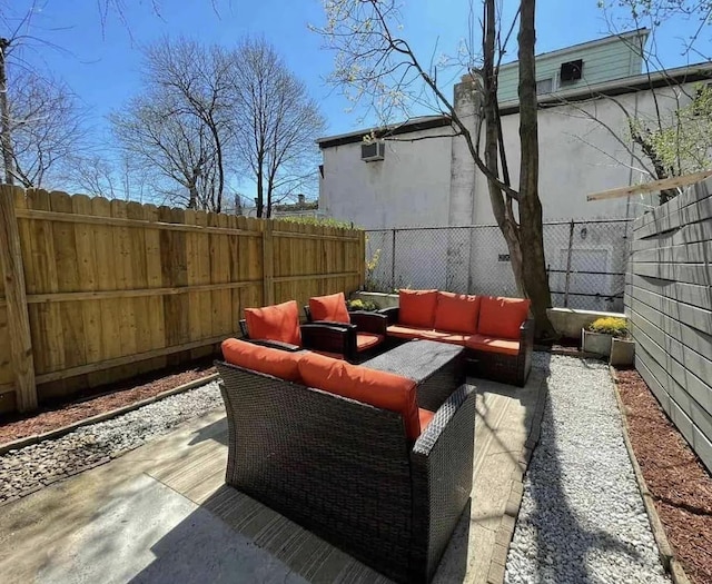 view of patio / terrace featuring a fenced backyard and an outdoor living space