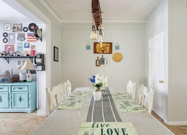 dining space featuring ornamental molding