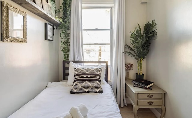 bedroom featuring light tile patterned floors